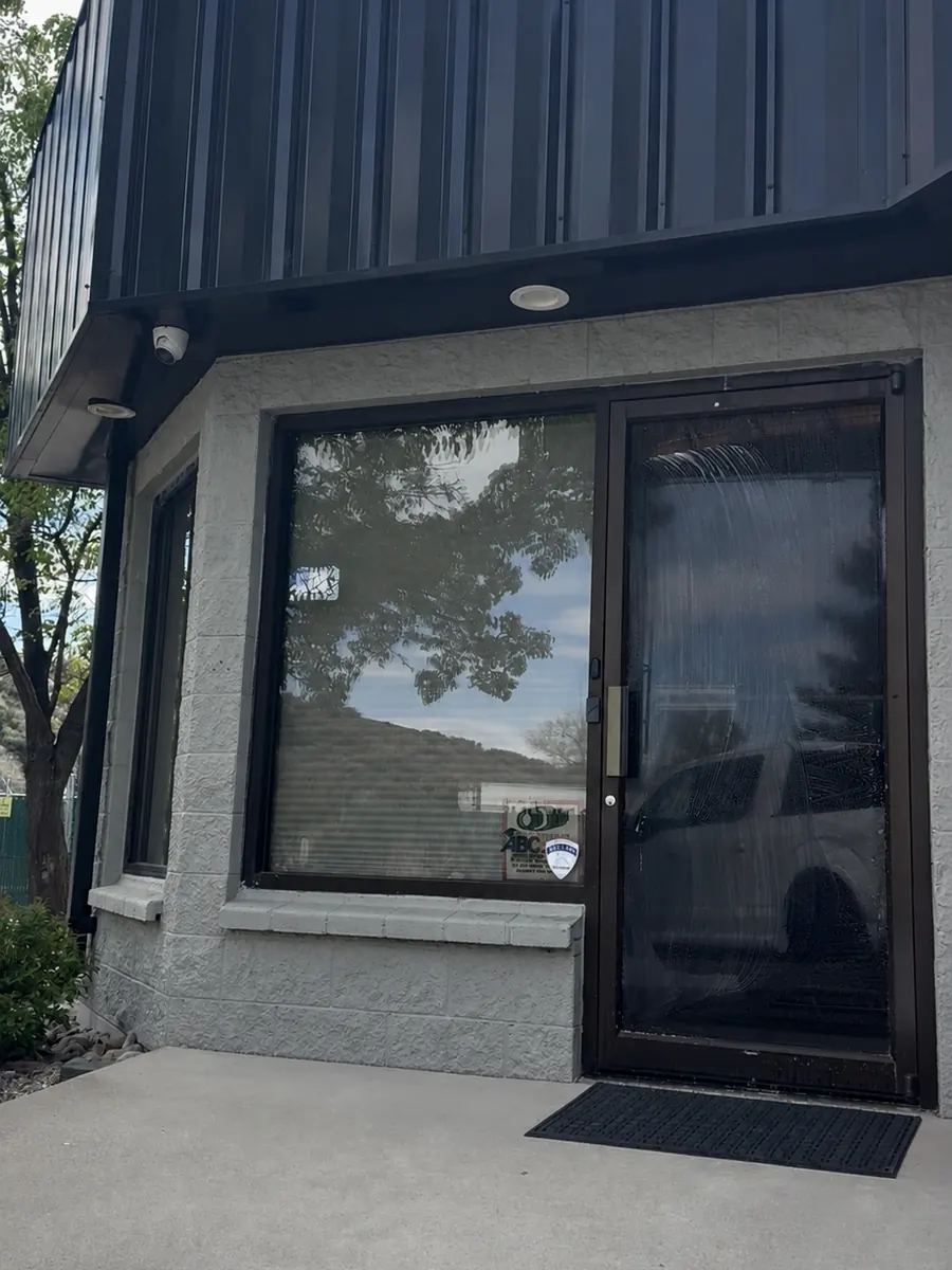 Miller Concrete office windows before graphics, plain dark glass
