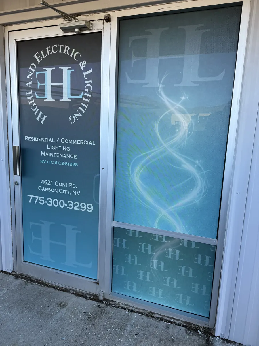 Highland Electric and Lighting glass doors with branded film, frosted at the bottom