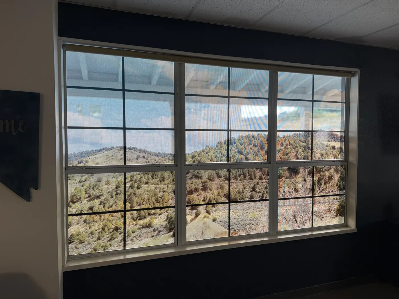 Printed window film on the Virginia City High School library windows showing the hills