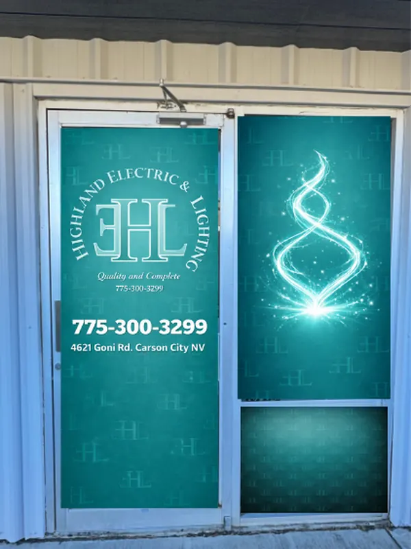 Mockup of the Highland Electric and Lighting door graphics shown on a photo of their actual doors